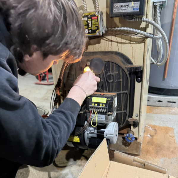 HVAC technician inspecting equipment